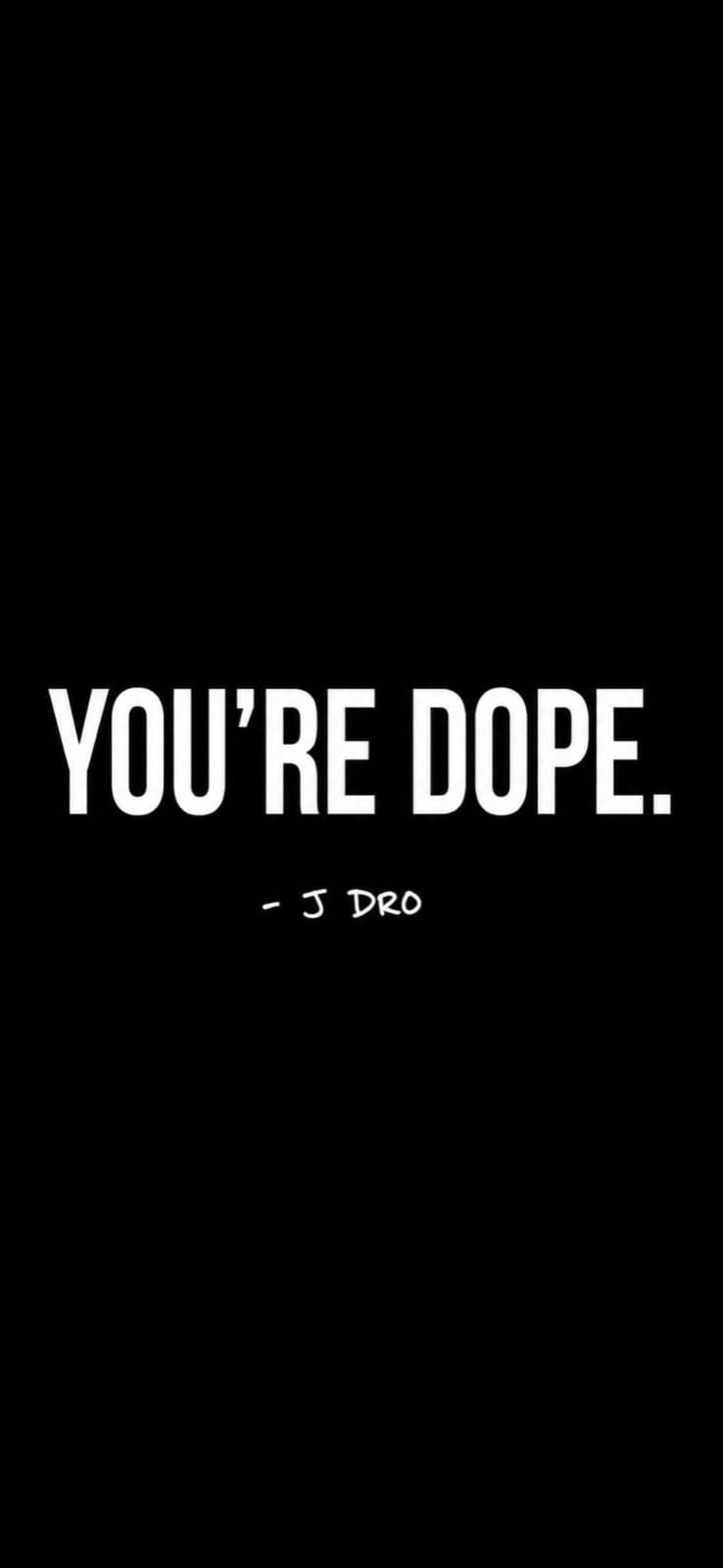 Black poster that reads YOU’RE DOPE, signed J DRO